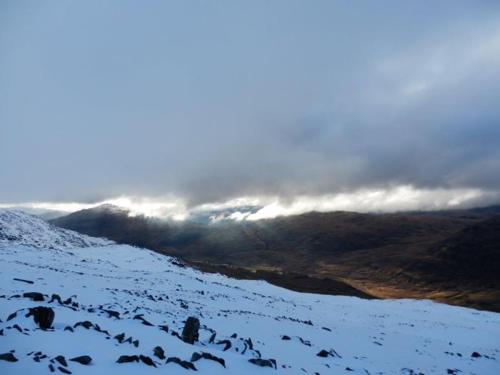 The last remnants of the evening sun over distant Eskdale